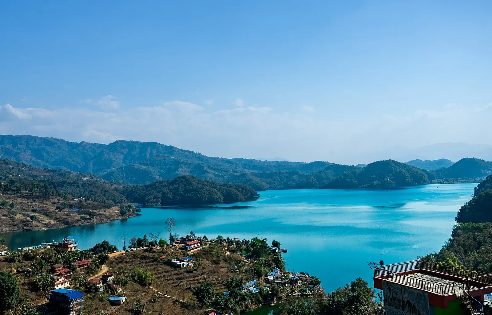 Begnas Lake seen from the Sundari Danda ridge, with wooded hills around its shore.