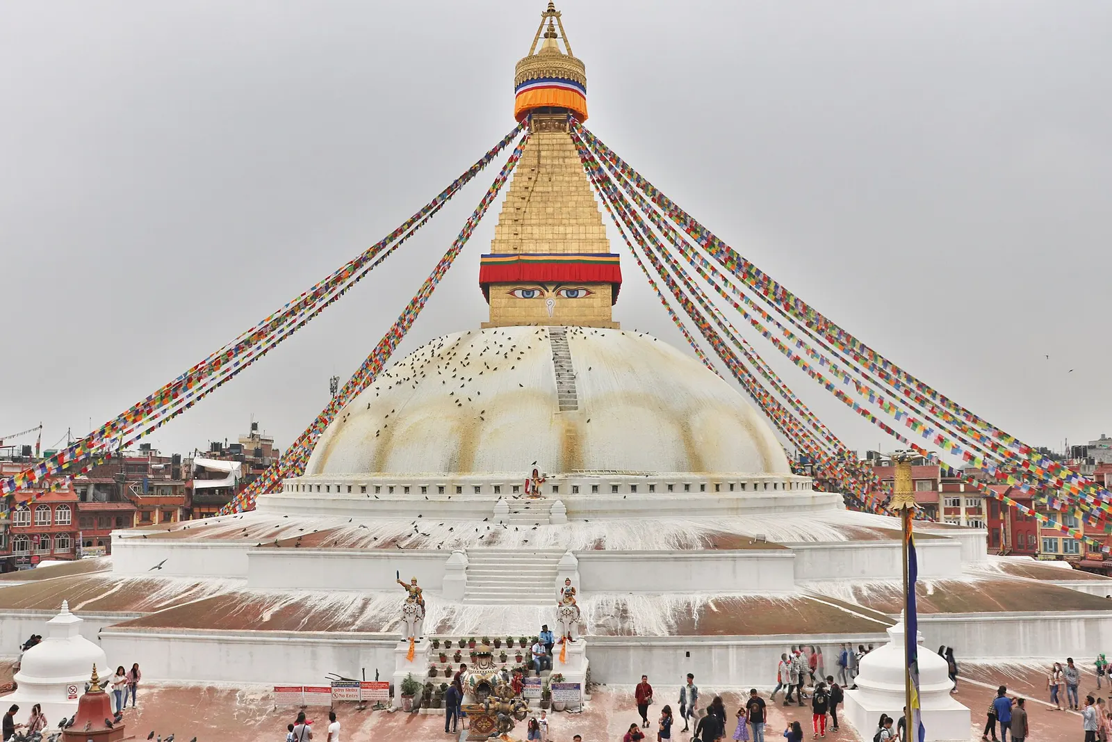 The great white dome of Boudhanath stupa with its gilded tower and prayer flags, Kathmandu.