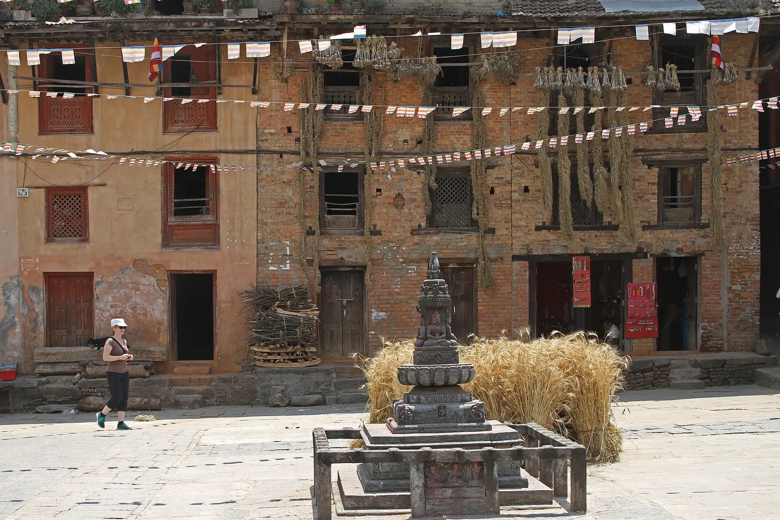 The main square of Bungamati with its temple and surrounding brick houses.