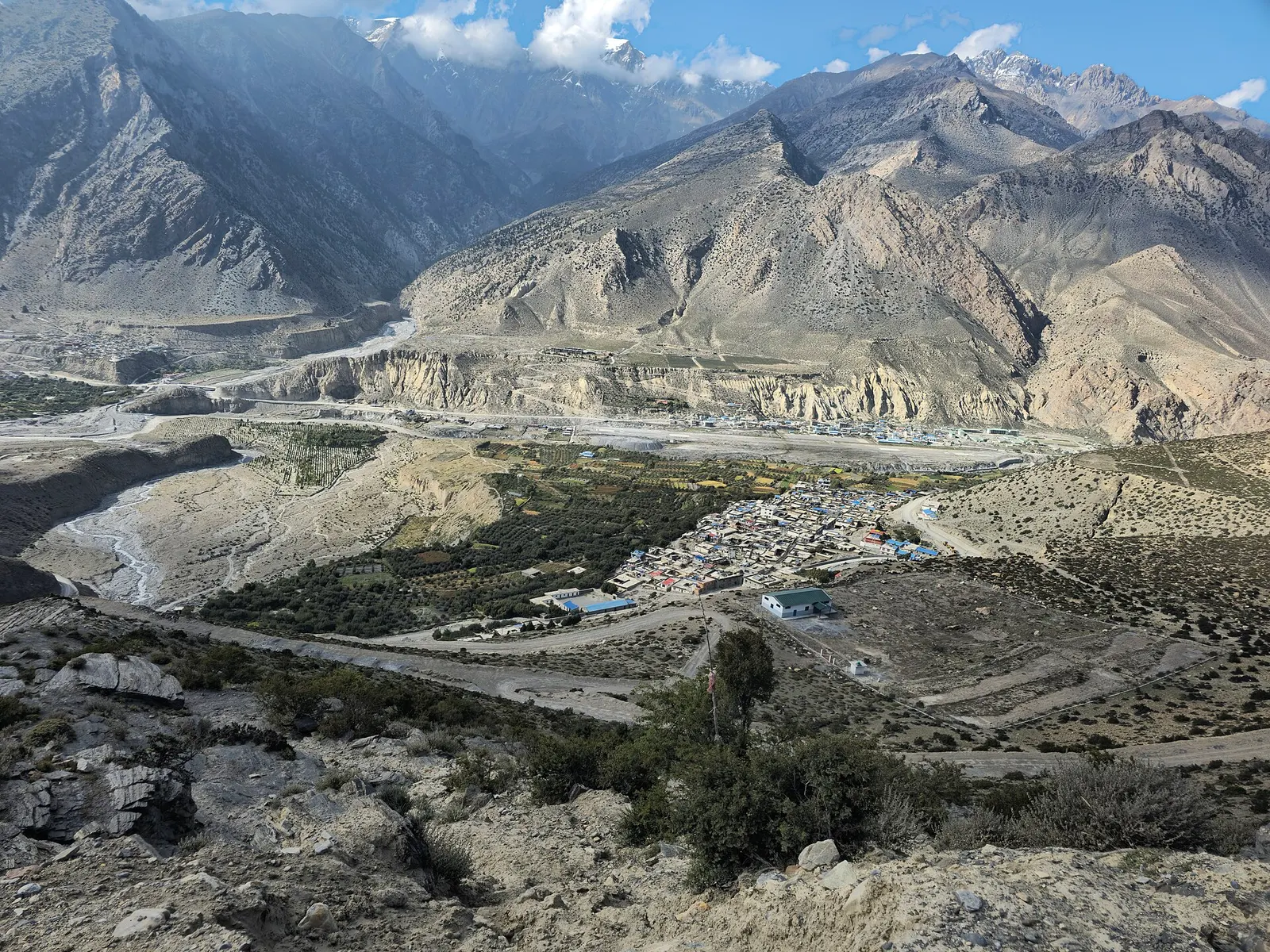 Jomsom town spread along the Kali Gandaki, seen from a viewpoint above.