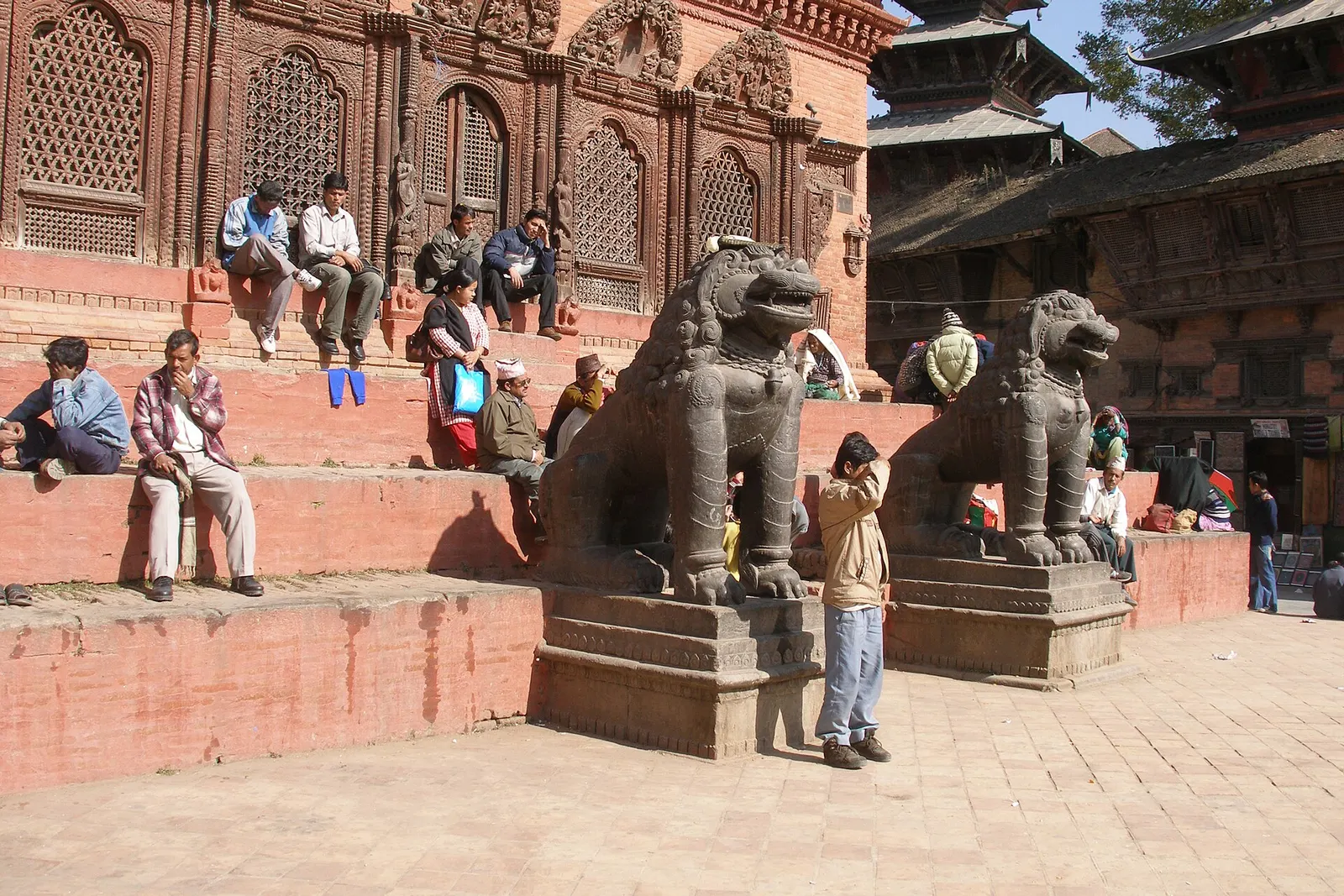 The Shiva Parvati temple with stone lions in Kathmandu Durbar Square.