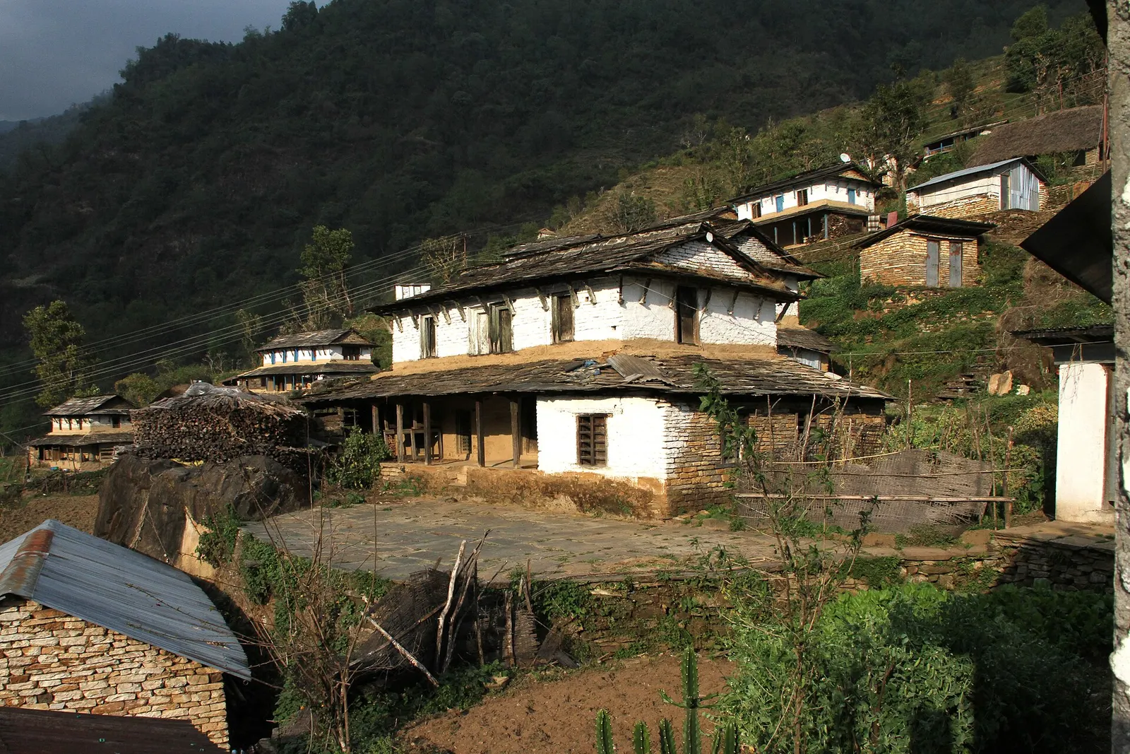 Houses of Landruk village spread along a ridge above the Modi Khola valley.