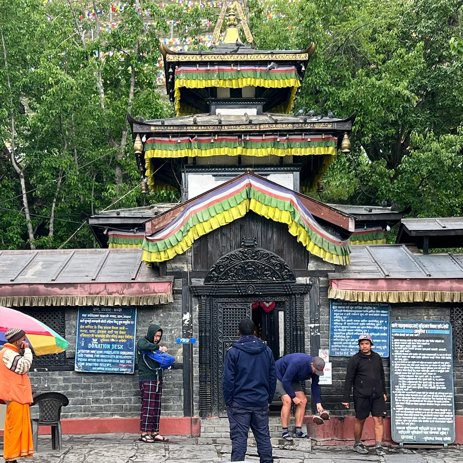 The main shrine of Muktinath temple with prayer flags.