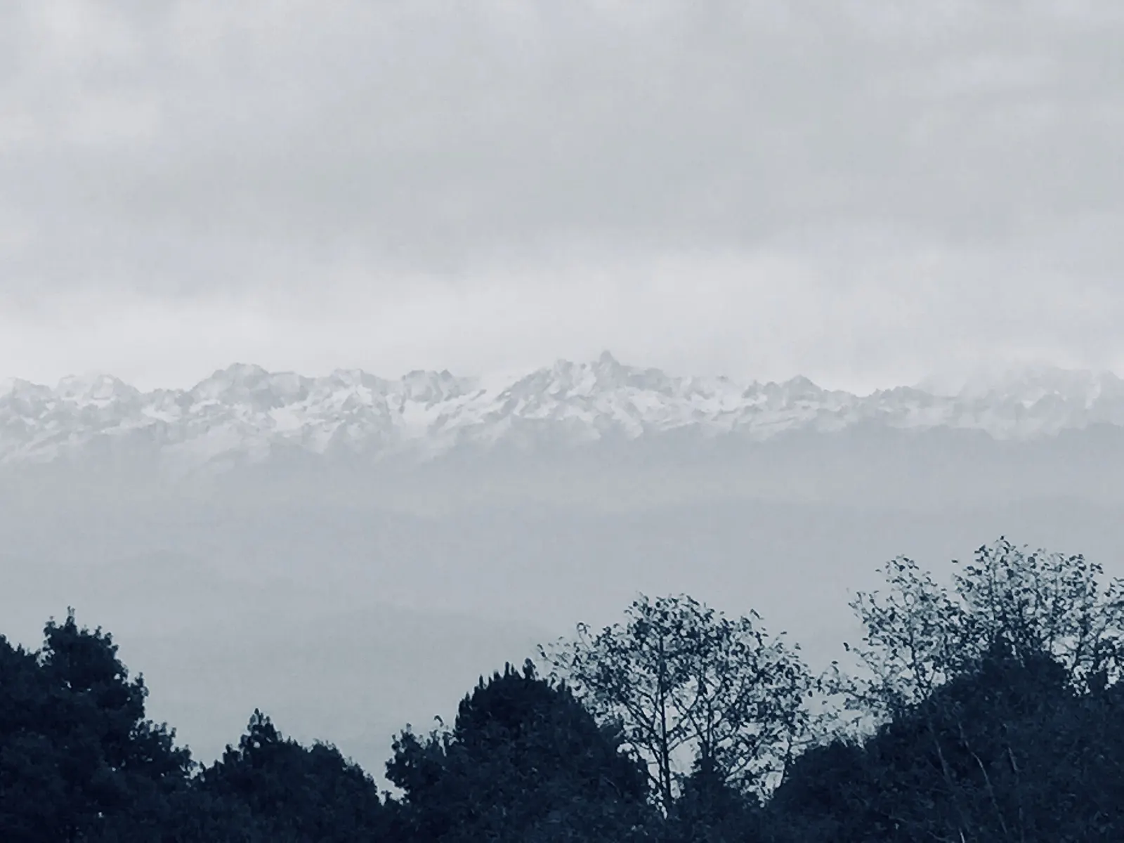 Snow-capped Himalayan peaks on the horizon seen from Nagarkot.