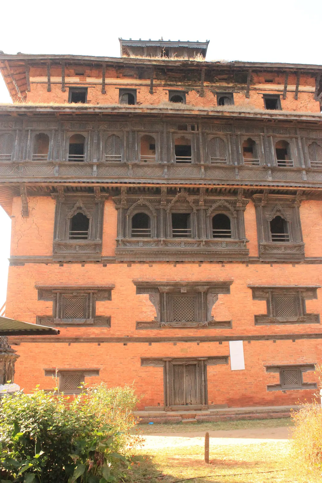 The tall seven-storey palace tower of Nuwakot Durbar with carved windows.
