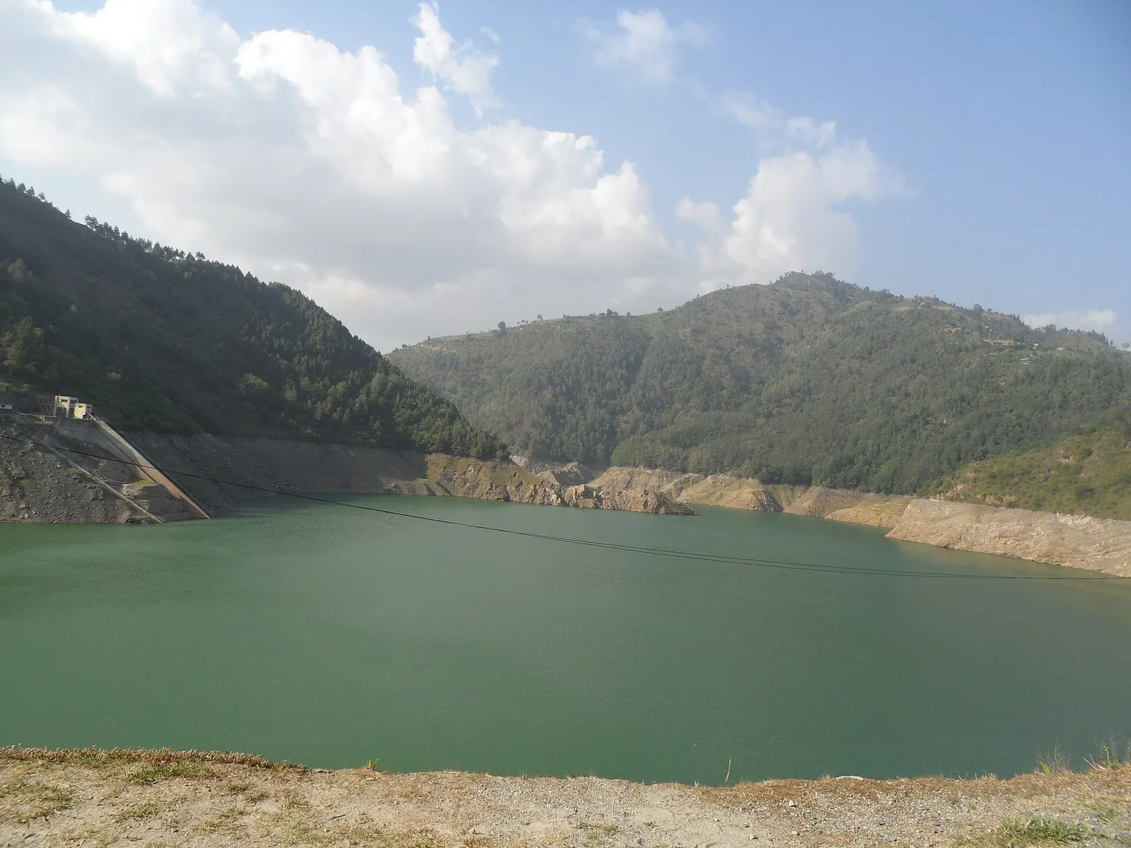 The Kulekhani reservoir stretching between forested hills.